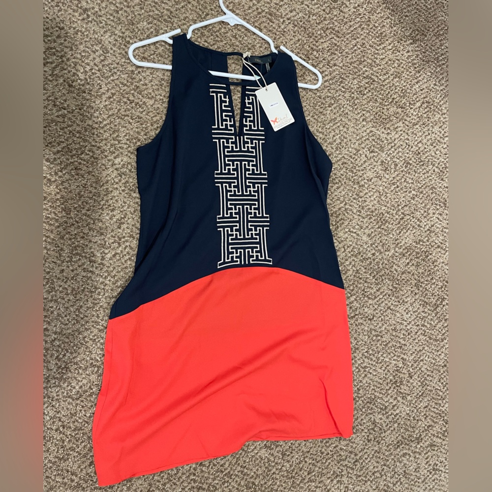 Orange, white and blue dress with front detail.